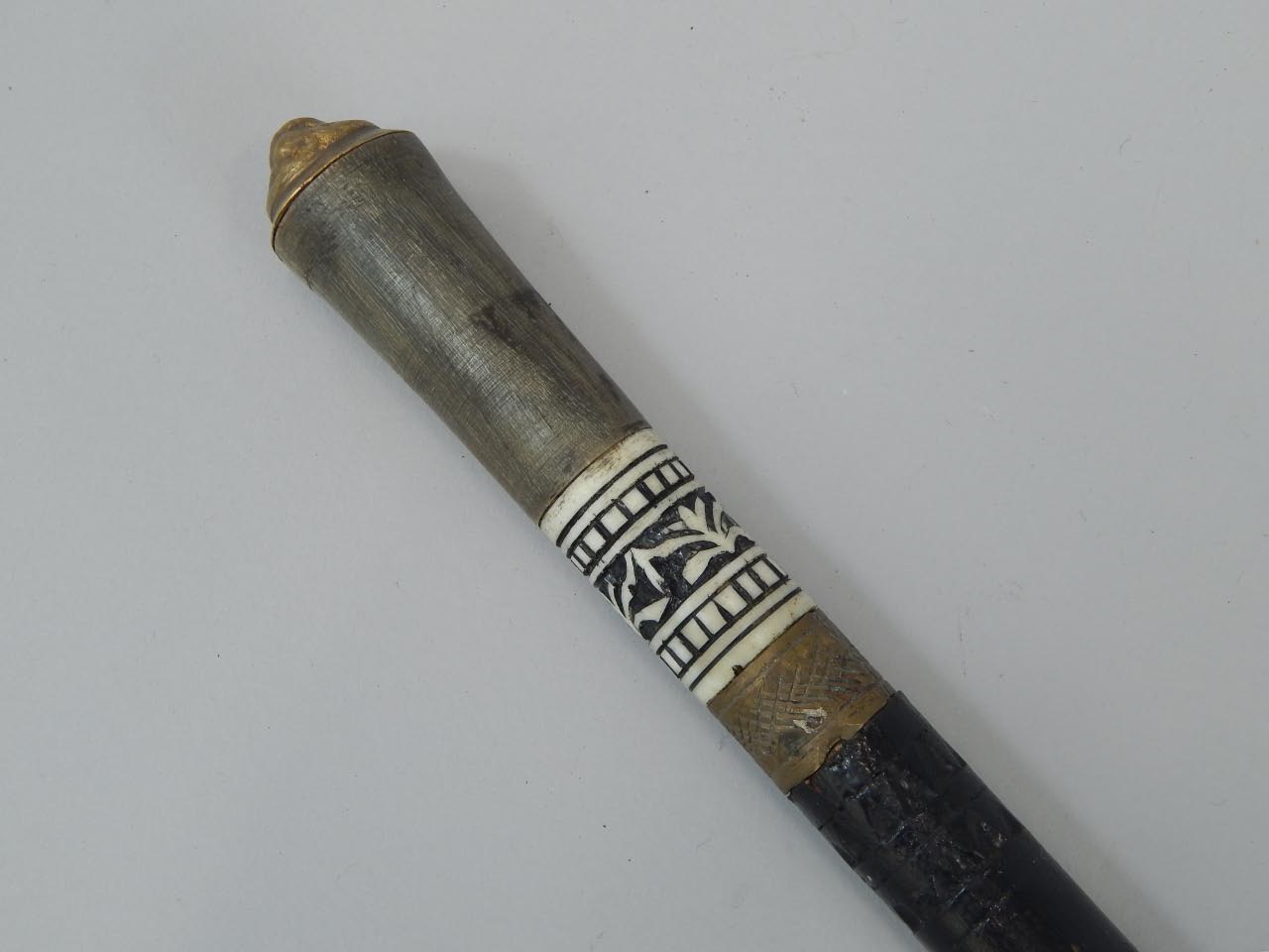 Appraisal: An early thC sword stick with ebonised shaft and decorative