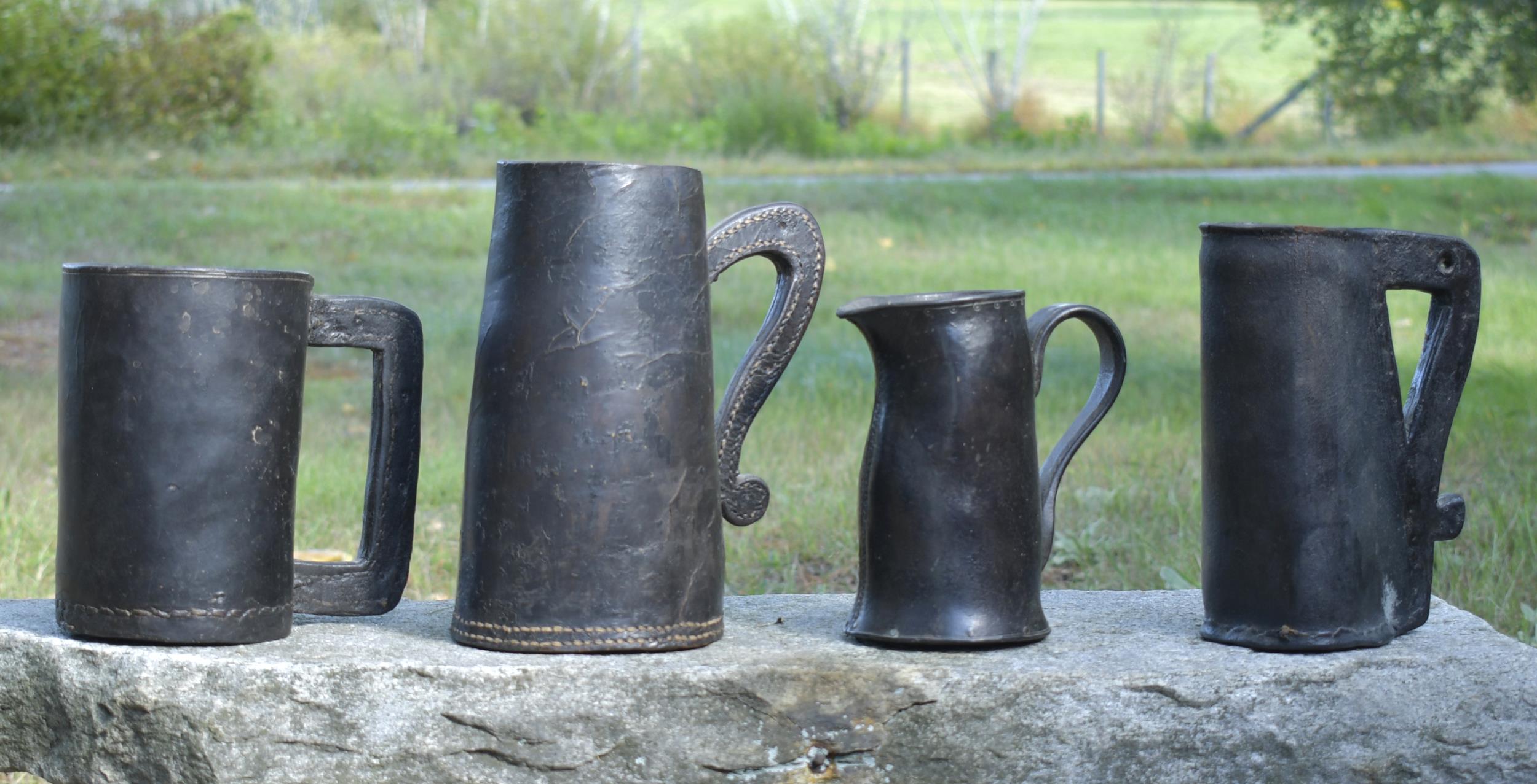 Appraisal: FOUR EARLY LEATHER TANKARDS th and early th C single