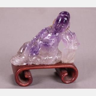 Appraisal: A Chinese Carved Amethyst of a Reclining Figure on a