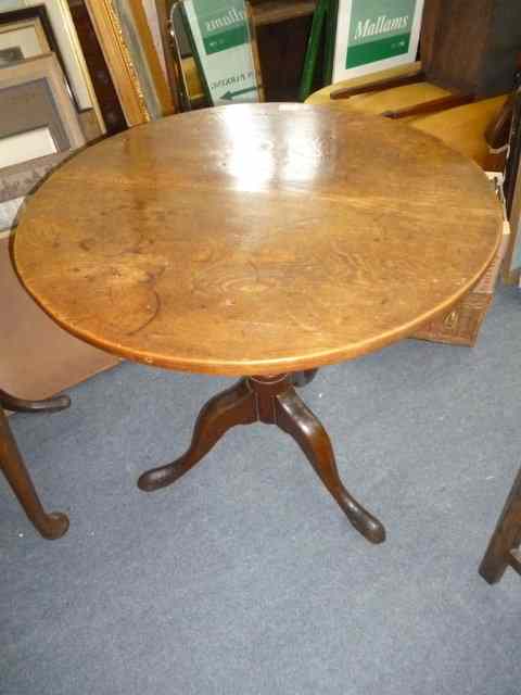 Appraisal: A GEORGIAN OAK CIRCULAR TILT TOP TRIPOD TABLE diameter