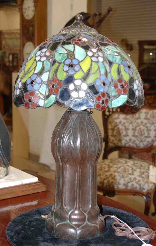 Appraisal: STAINED AND LEADED GLASS TABLE LAMP the shade having floral