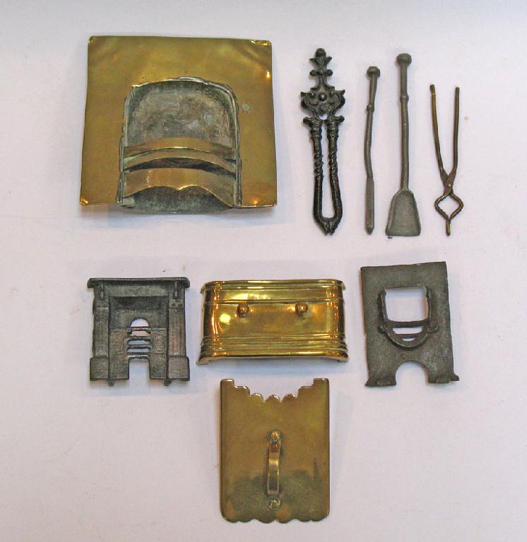 Appraisal: TWO CAST IRON MINIATURE FIREPLACES and a collection of miniature