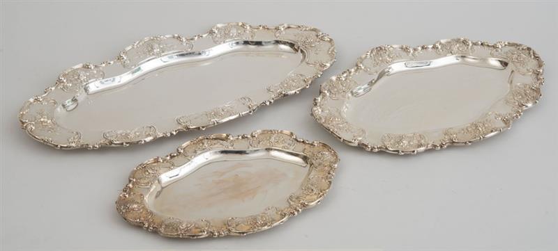 Appraisal: THREE AMERICAN SILVER GRADUATED PLATTERS Each marked with lion-headed dolphin