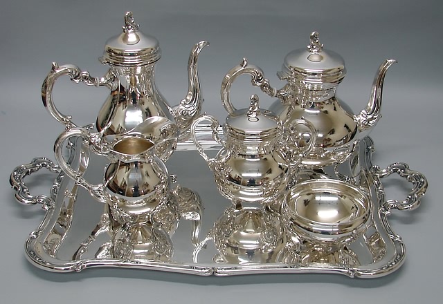 Appraisal: Marked Delpilar globose body scrolled handles consisting of teapot coffee