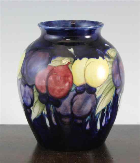 Appraisal: A Moorcroft Wisteria pattern ovoid vase c - decorated in