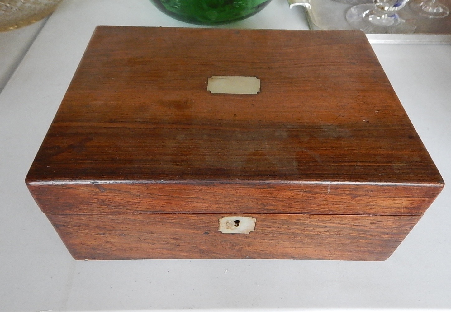 Appraisal: A Victorian rosewood workbox with mother of pearl inset lid