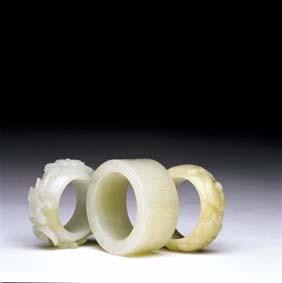 Appraisal: THREE ANTIQUE WHITE JADE RINGS Group of three antique Chinese