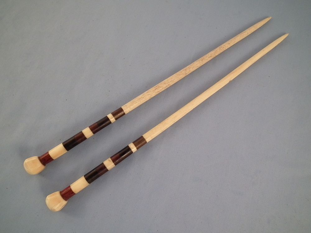 Appraisal: WHALE BONE NEEDLES Pair of inch long sailor made whale