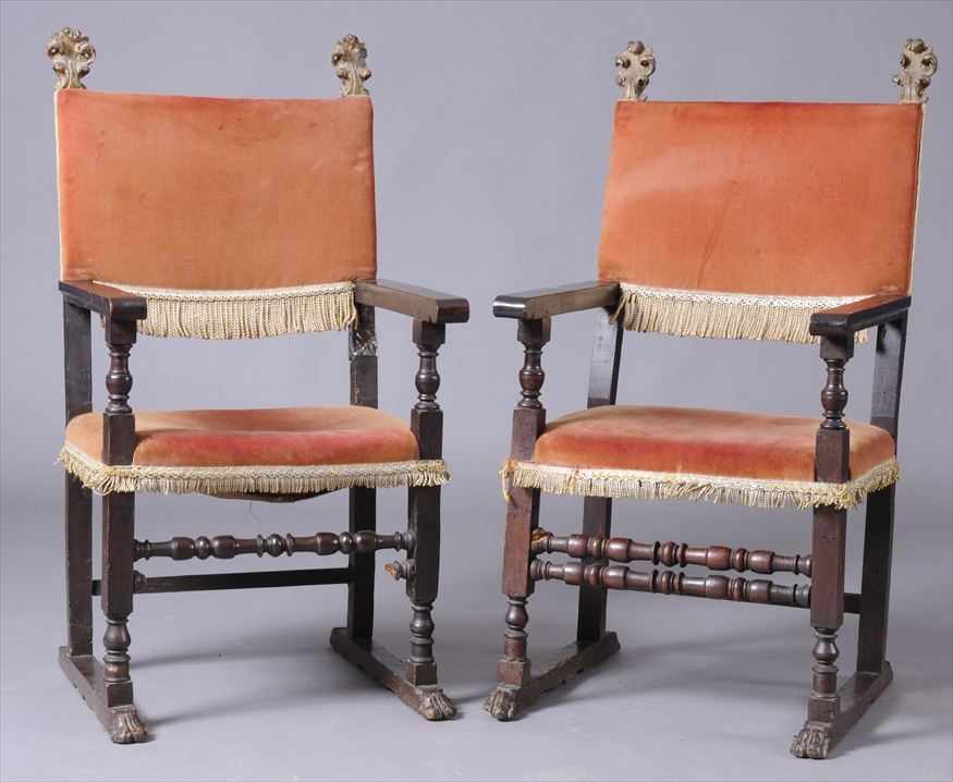 Appraisal: PAIR OF ITALIAN BAROQUE CARVED WALNUT AND PARCEL-GILT ARMCHAIRS WITH