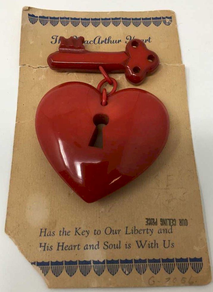 Appraisal: Large Red Bakelite Macarthur Heart Pin W Original Card Large