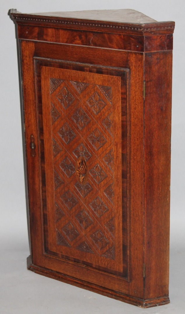 Appraisal: A principally late thC oak and mahogany corner cupboard with