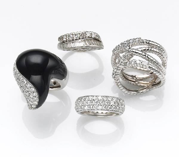 Appraisal: A group of four diamond black onyx platinum and k