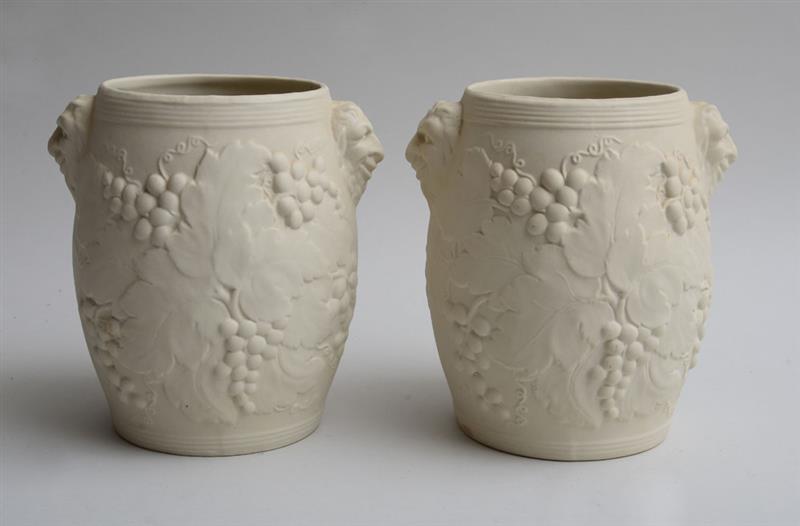 Appraisal: PAIR OF BISQUE POTTERY WINE COOLERS Stamped each fitted with