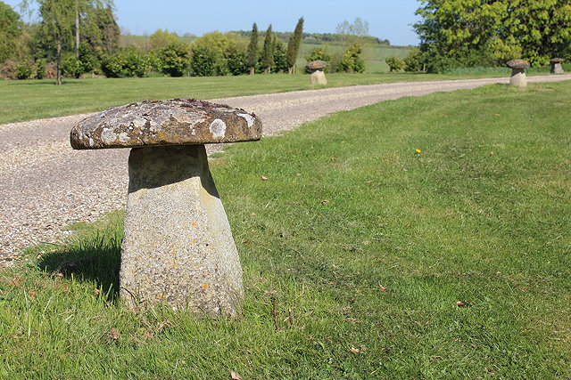 Appraisal: A SET OF EIGHT RECONSTITUTED STONE STADDLE STONES each approximately