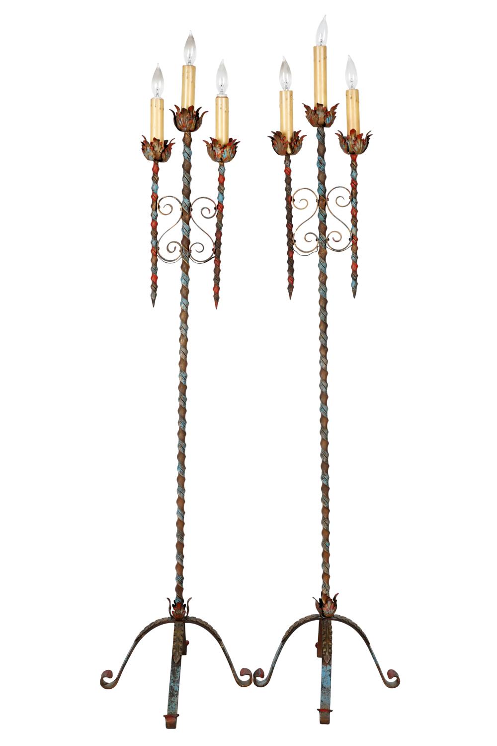 Appraisal: PAIR OF PAINTED TOLE IRON THREE-LIGHT CANDELABRAelectrified inches tall Condition