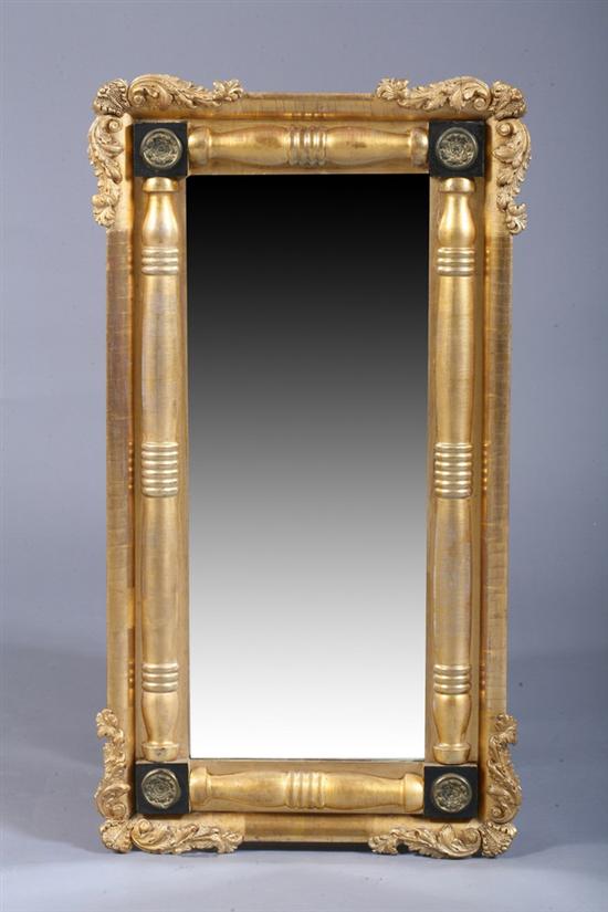 Appraisal: EMPIRE GILT-WOOD SPLIT-SPINDLE WALL MIRROR th century with ebonized corner