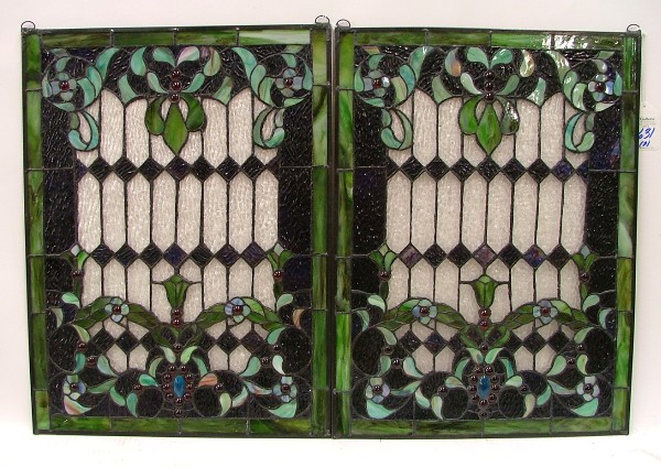 Appraisal: PAIR STAINED AND LEADED GLASS WINDOW PANELS having stylized flowering