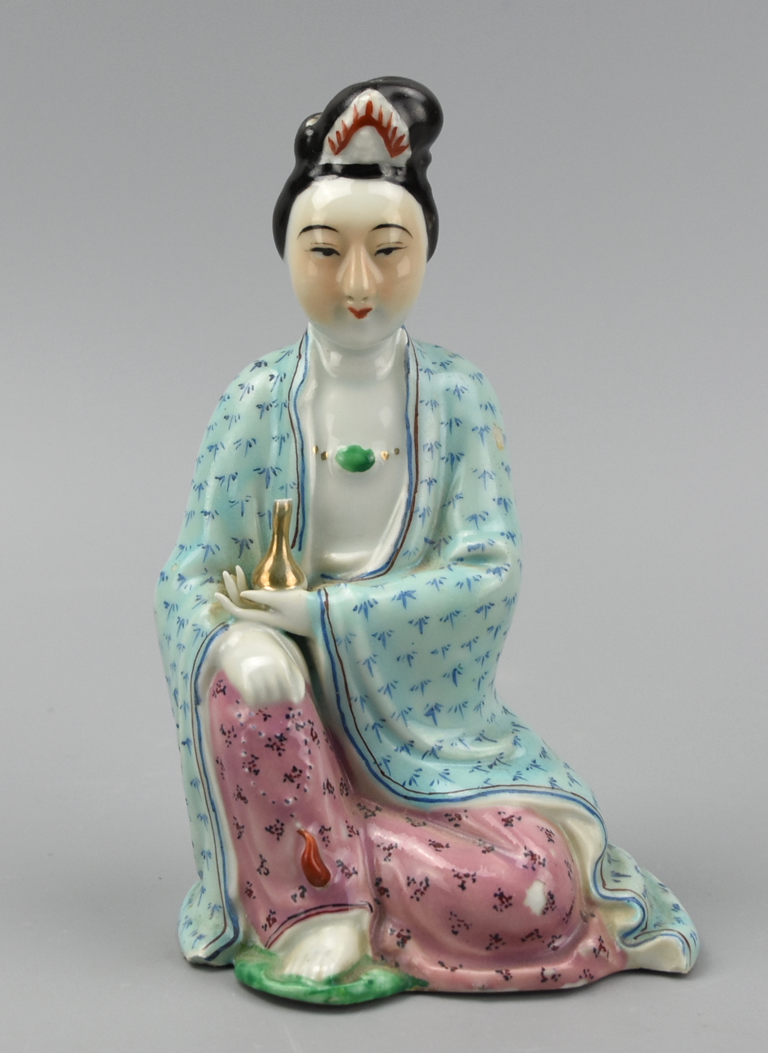 Appraisal: CHINESE SEATED FAMILLE ROSE FIGURE OF GUANYIN ROC A Chinese