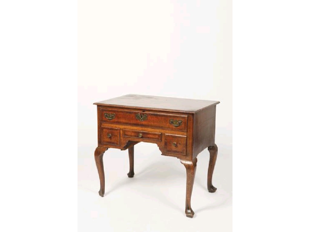 Appraisal: A GEORGE III OAK LOWBOY with a rectangular top over