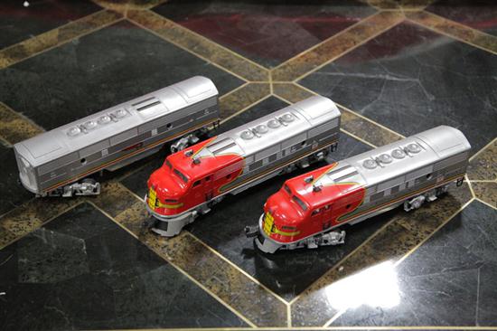 Appraisal: THREE LIONEL TRAIN CARS Two Santa Fe locomotives and ''B''