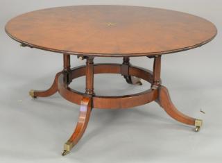 Appraisal: Custom mahogany round dining table with star inlaid center on