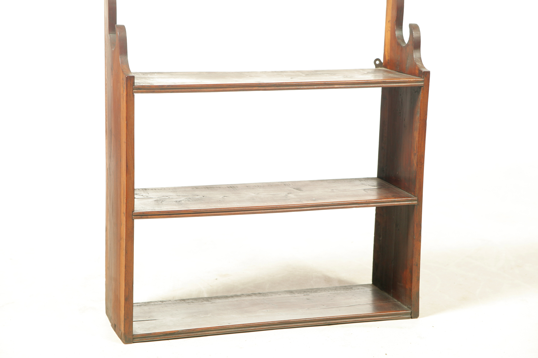 Appraisal: HANGING SHELVES American th century cherry Dovetailed with shaped sides