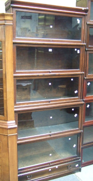 Appraisal: A th century oak five section bookcase the top three