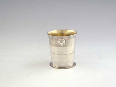 Appraisal: A Victorian collapsible beaker with four engine turned sections gilt