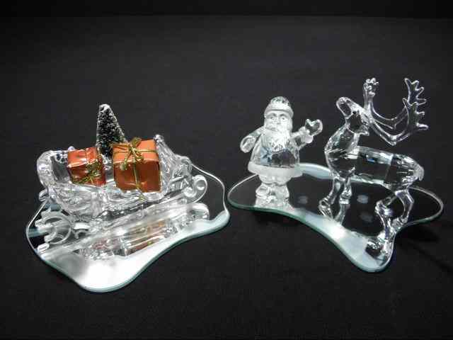 Appraisal: Swarovski crystal holiday group Includes crystal sleigh Santa figurine and