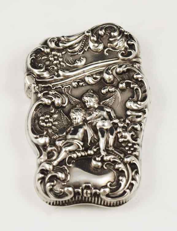 Appraisal: STERLING REPOUSSE UNGER BROTHERS CHERUBIC MATCHSAFE Featuring cherubs floral and