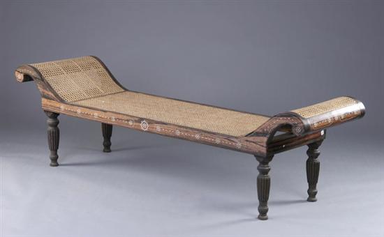 Appraisal: ANGLO-PHILIPPINE REGENCY INLAID EBONY AND CANE DAY BED th century