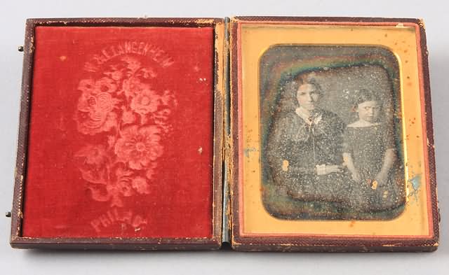 Appraisal: Quarter plate daguerreotype of woman and small girl waist up