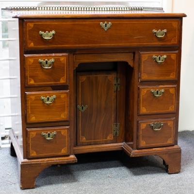 Appraisal: A George III mahogany and inlaid kneehole desk the top