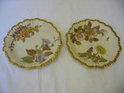 Appraisal: A PAIR OF ROYAL WORCESTER IVORY PORCELAIN PLATES of fluted