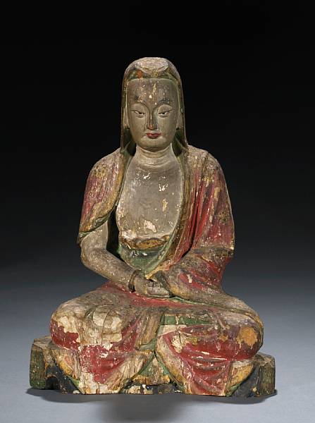 Appraisal: A polychrome painted wood luohan Ming Dynasty Seated dhyanasana with