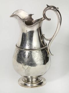 Appraisal: th century American coin silver water pitcher by William K