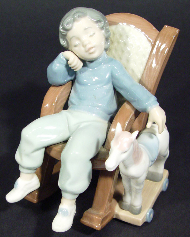 Appraisal: Lladro porcelain figure group 'All Tuckered Out' printed factory mark