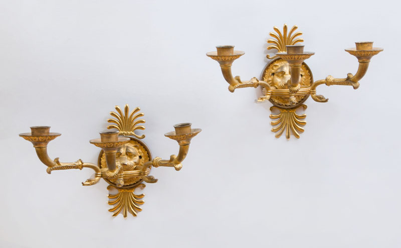 Appraisal: PAIR OF EMPIRE STYLE GILT-BRONZE THREE-LIGHT WALL SCONCES Each lion-head