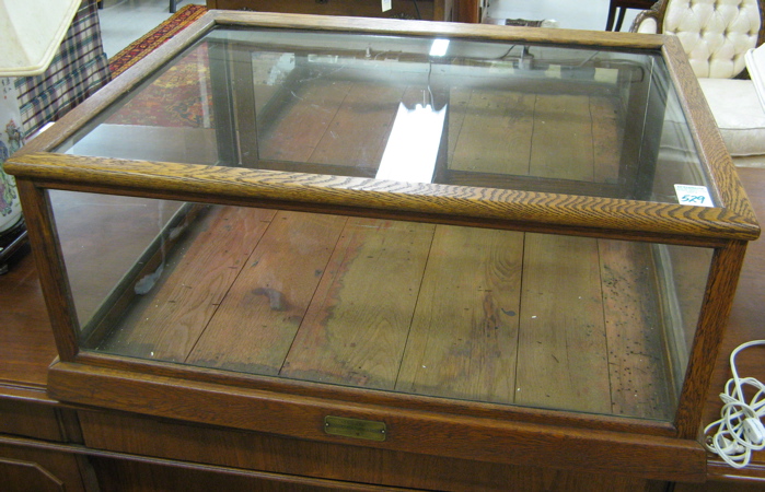 Appraisal: SMALL OAK AND GLASS COUNTER-TOP SHOWCASE American c the oak