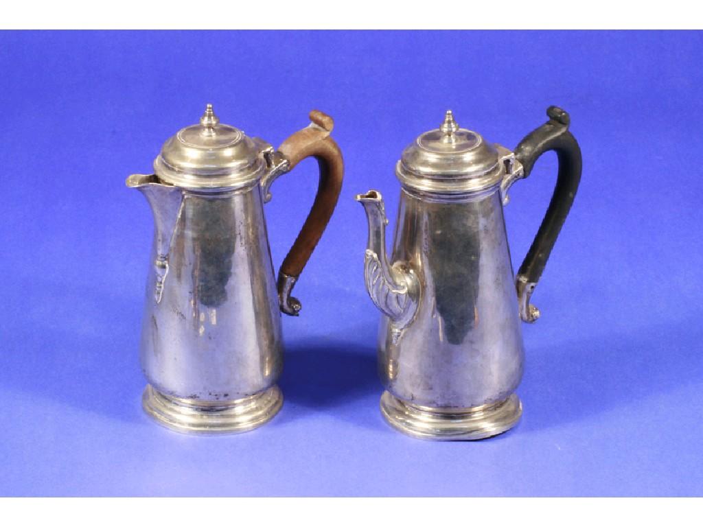 Appraisal: A COFFEE POT of tapering circular form with scroll handle