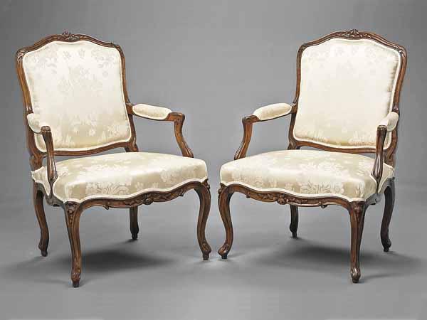 Appraisal: A Pair of Louis XV Carved Beechwood Fauteuils late th