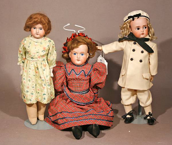 Appraisal: Bisque doll grouping Lot includes three socket body German dolls