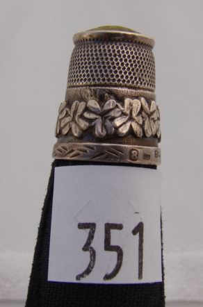 Appraisal: English thimble with shamrocks green stone cap