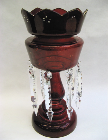 Appraisal: A RUBY RED GLASS LUSTRE with elongated clear hanging faceted