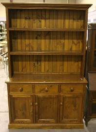 Appraisal: A Victorian style pine dresser with three open shelves over