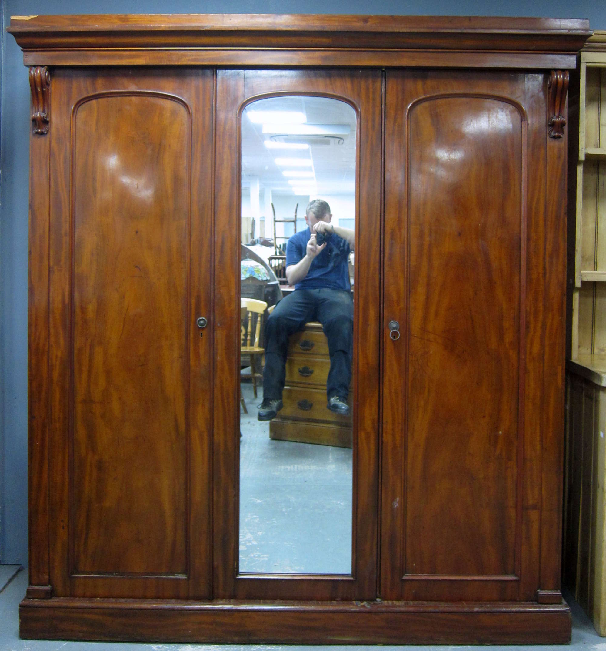 Appraisal: Mahogany triple wardrobe with central mirrored door cm x cm