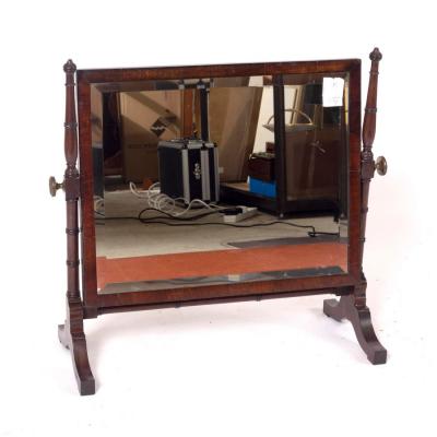 Appraisal: A mahogany swing frame dressing mirror on turned supports cm