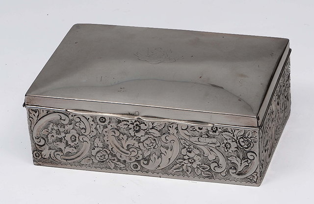 Appraisal: A silver cigarette boxof rectangular form with embossed acanthus decoration