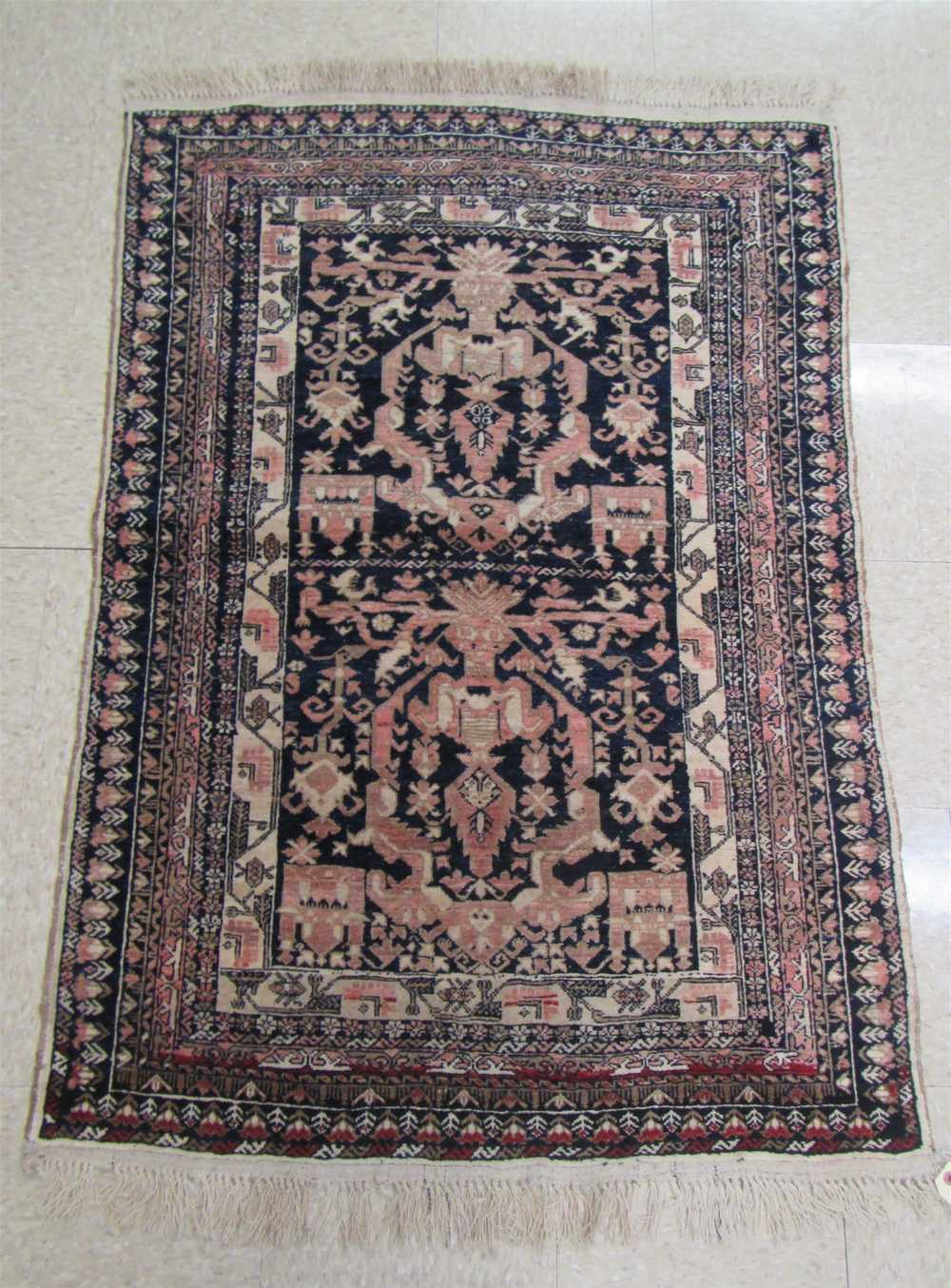 Appraisal: SEMI-ANTIQUE PERSIAN BELOUCH AREA RUG hand knotted in a stylized