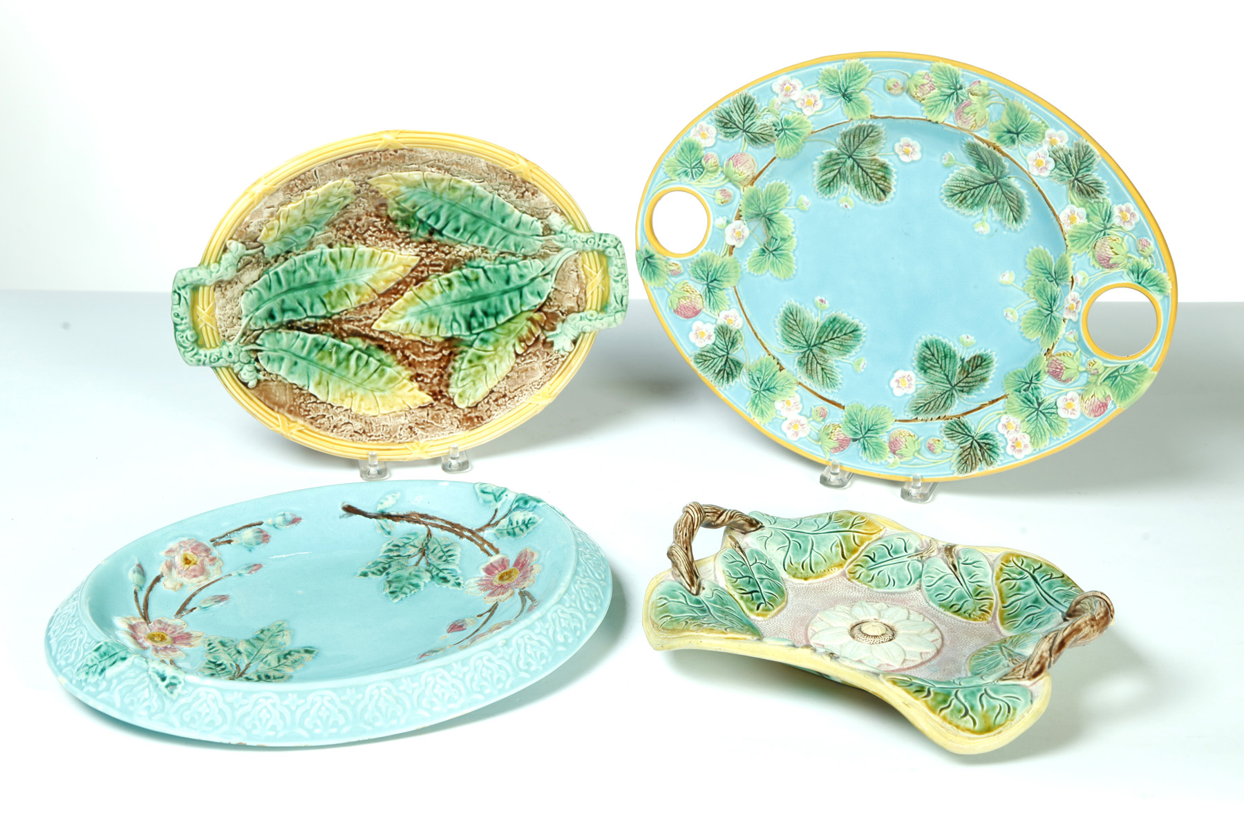 Appraisal: FOUR MAJOLICA DISHES England nd half- th century Three double-handled